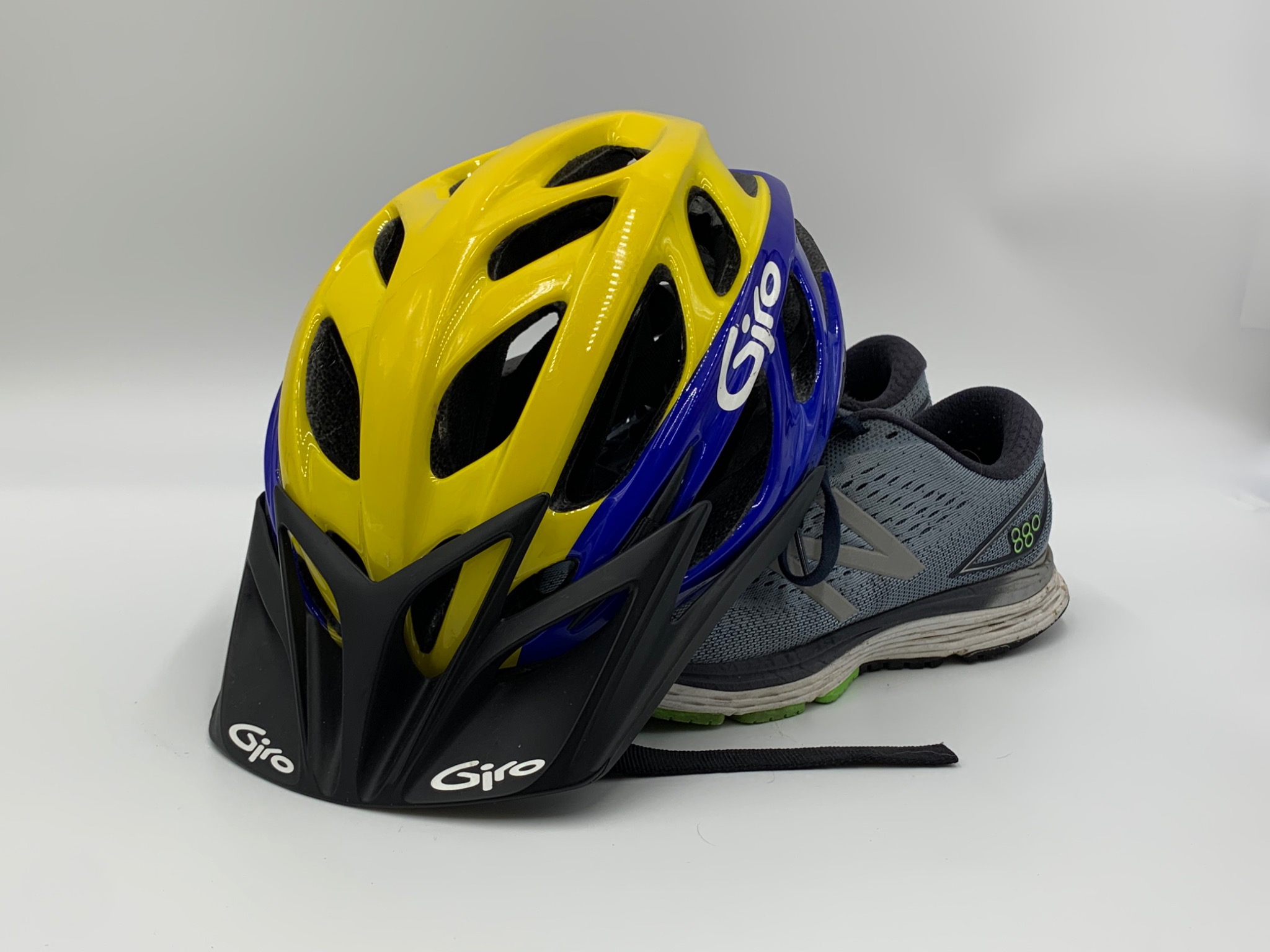 Yellow and blue cycling helmet with running shoes